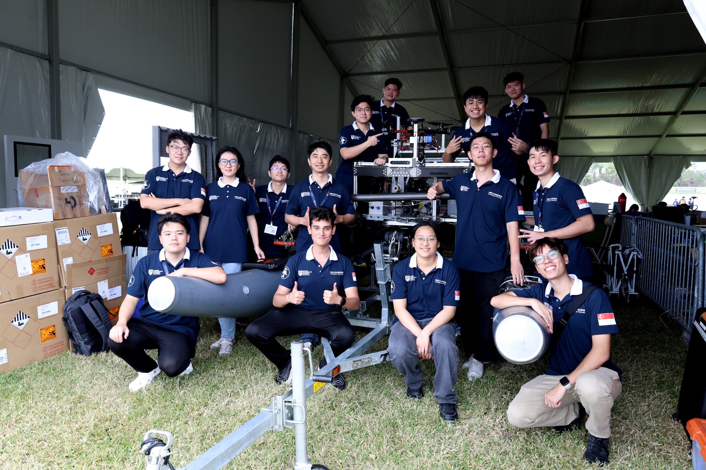 Team photo · current season, full group or a working shot from a water test or lab session.